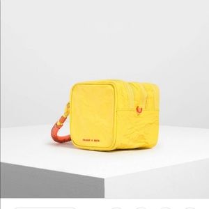 Charles and Keith crumpled effect yellow pouch